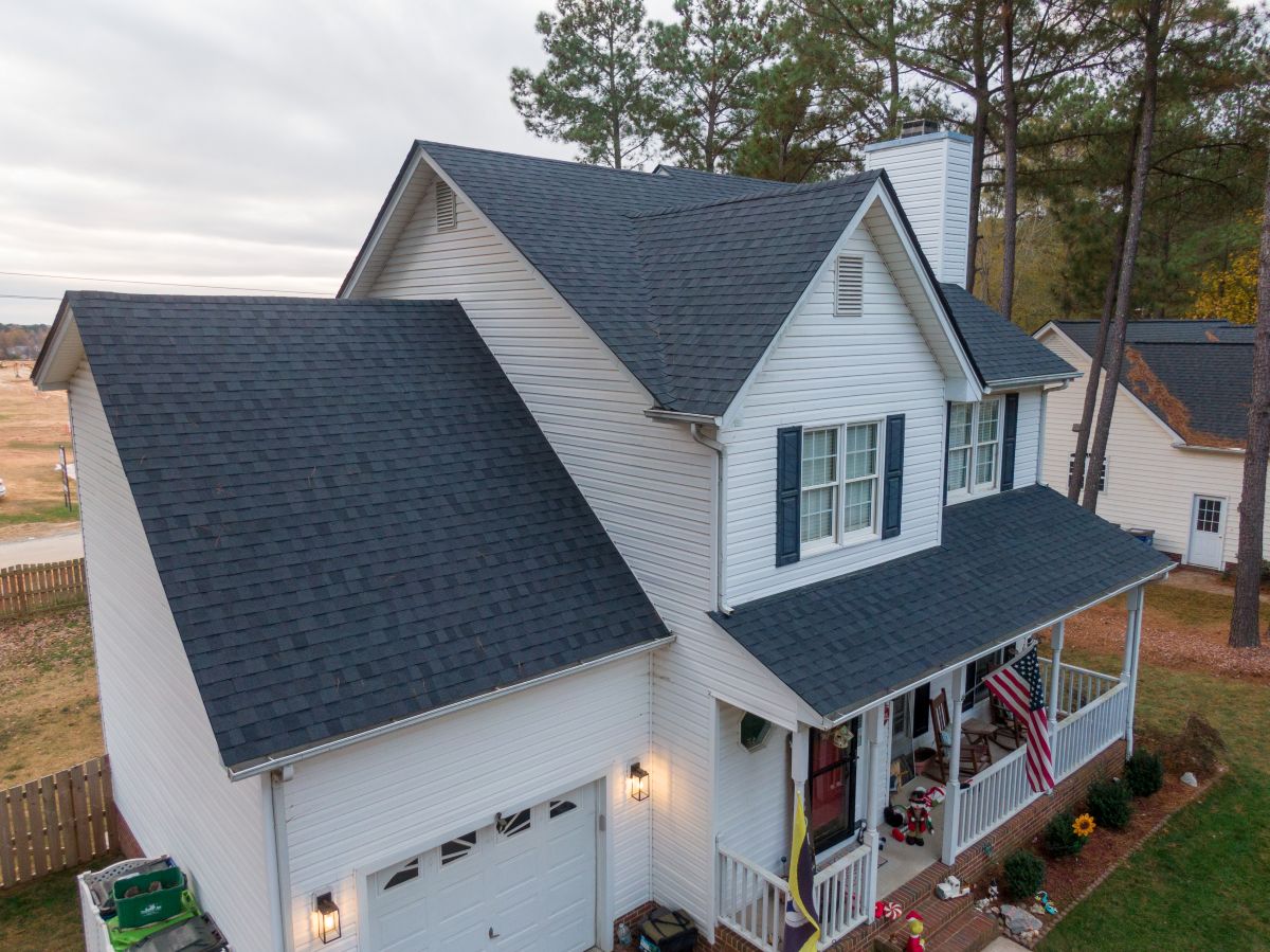 Aerial view of a Minneapolis home showing a full gutter run along the eaves — the baseline for any installation cost estimate