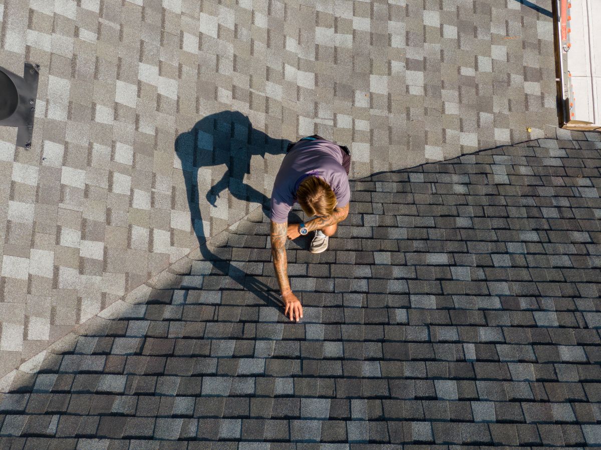 Roofing project manager conducting an inspection with an insurance adjuster