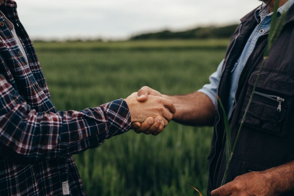 close up of two man handshake on f