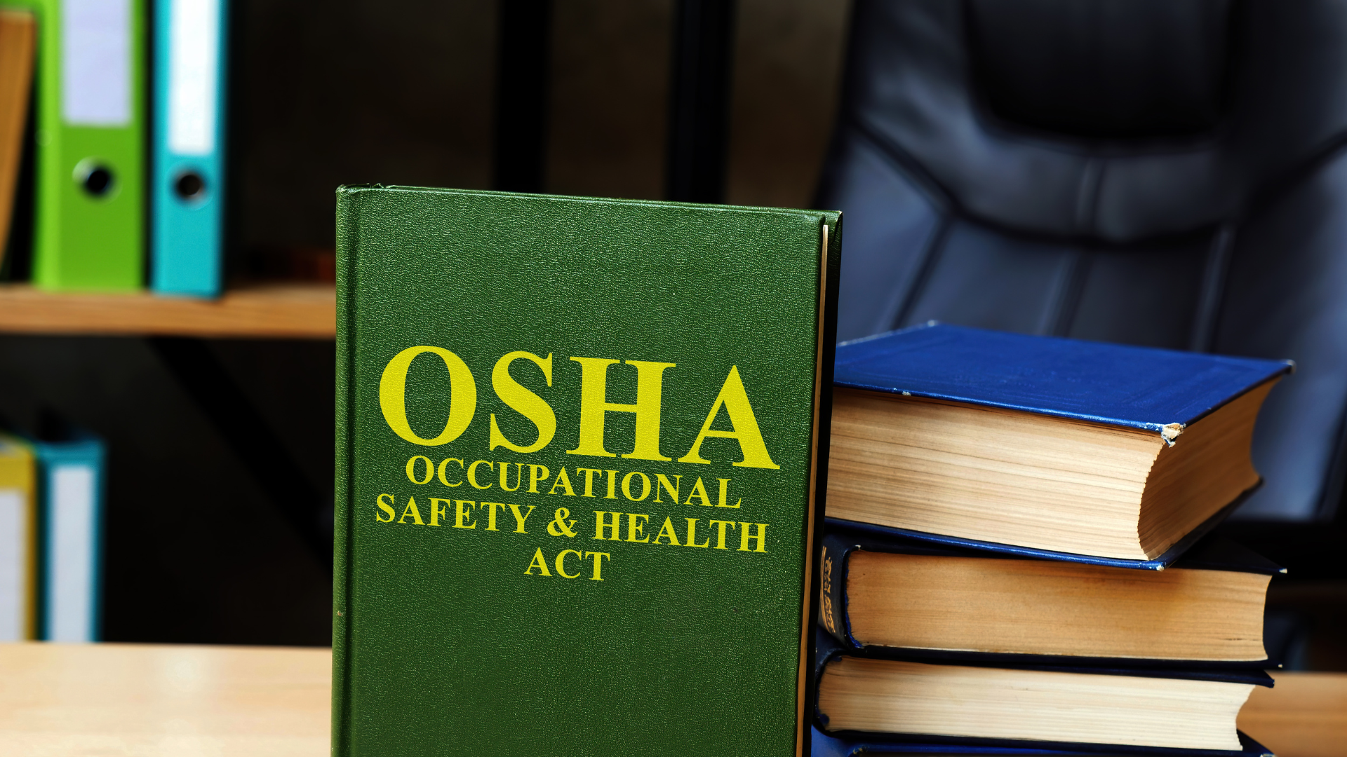 OSHA Occupational Safety & Health Act book on a desk, symbolizing safety compliance in roofing industry regulations.