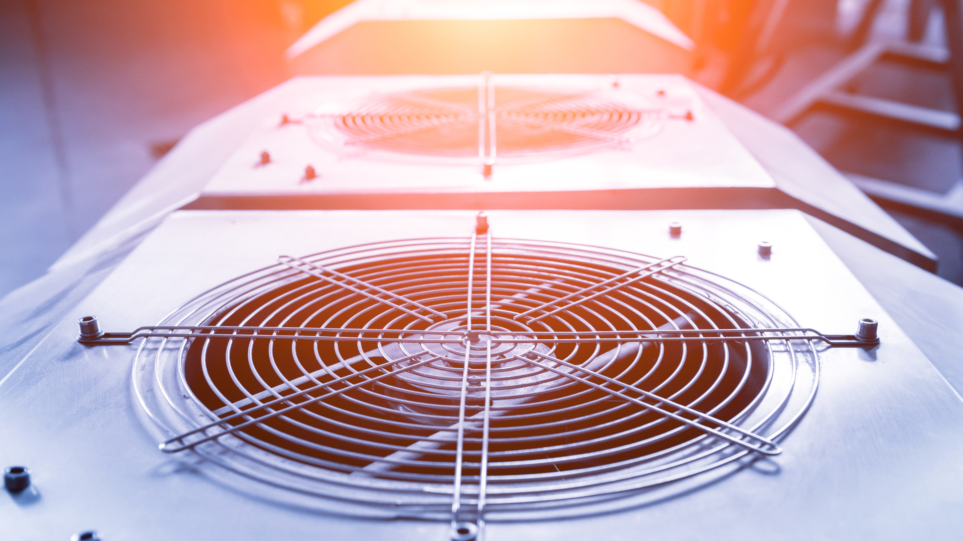 Close-up of HVAC unit fans, showcasing circular metal grilles and mechanical components, relevant to HVAC installation and maintenance in Minneapolis.
