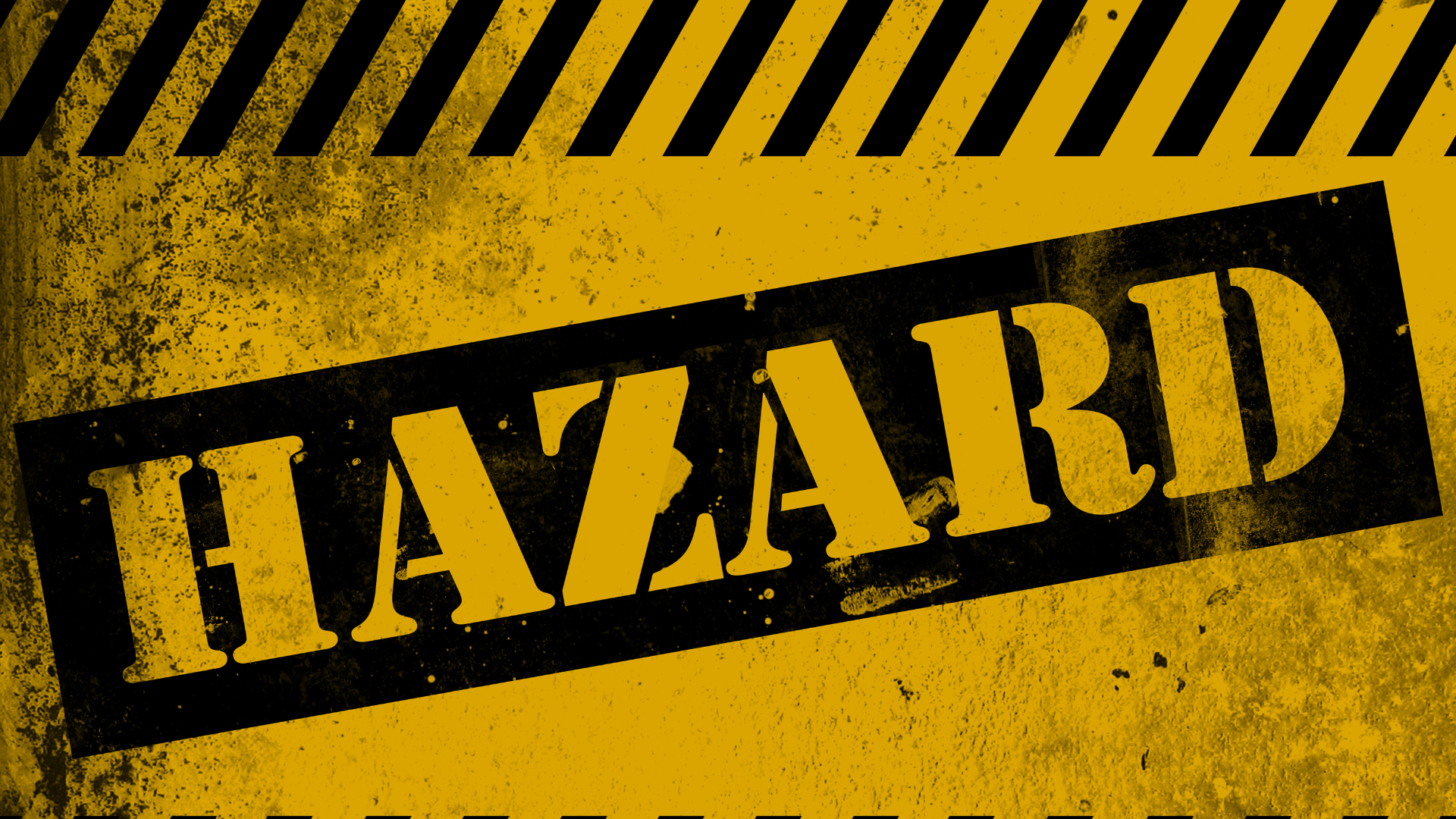 Hazard warning sign with bold black text on a yellow background, emphasizing safety in the roofing industry and the importance of hazard communication.
